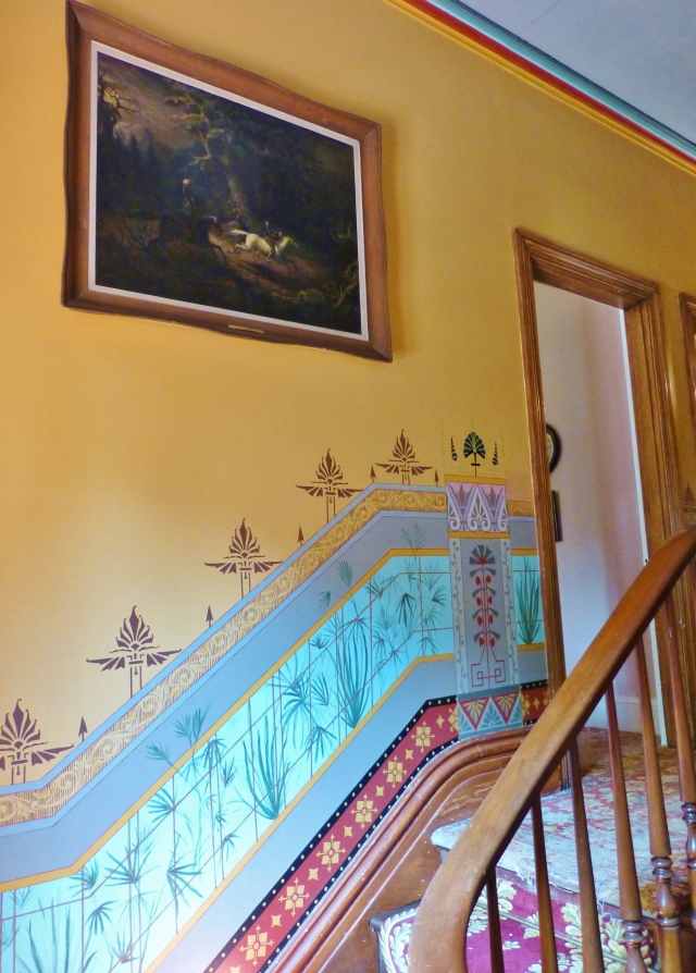 As we ascend the stairs from the foyer, a beautiful handpainted wainscoting takes shape on the landing. This colorful painting is in the style of the Aesthetic Movement with a little Asian influence thrown in.   The detailed painting has been restored exactly as the original, a portion of which is on view behind plexiglass in the upstairs hallway.